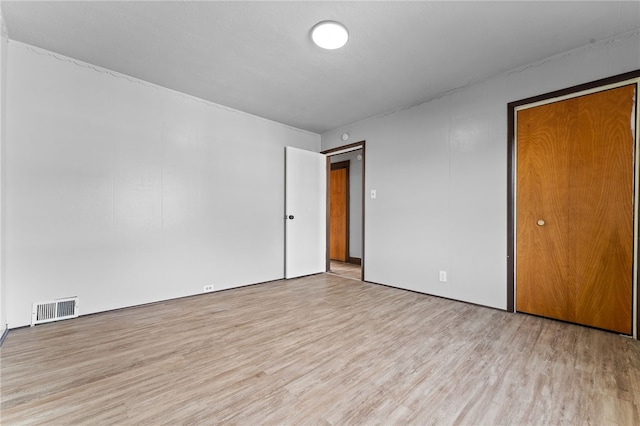 unfurnished room with light hardwood / wood-style floors