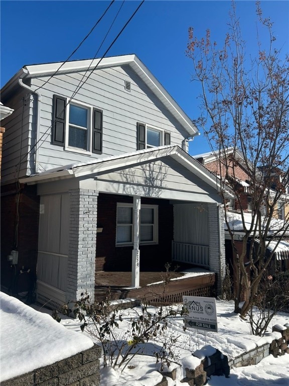 view of front of home featuring covered porch