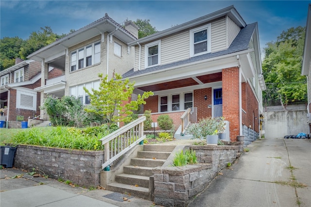 view of front of property featuring covered porch