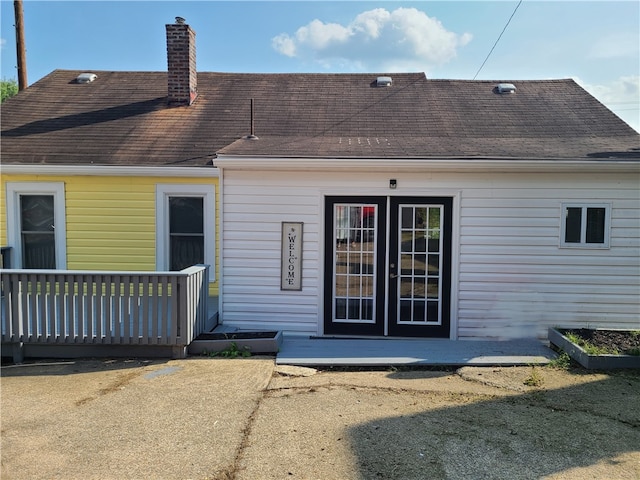 back of property featuring a deck