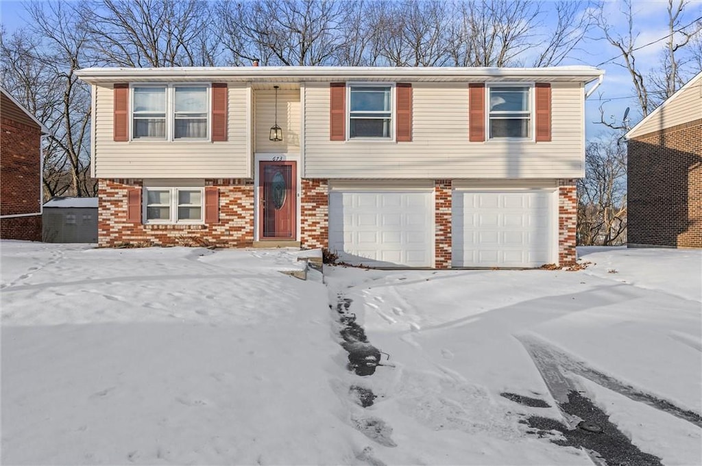 split foyer home featuring a garage