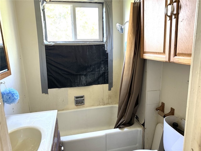 full bathroom with shower / bathtub combination with curtain, vanity, and toilet