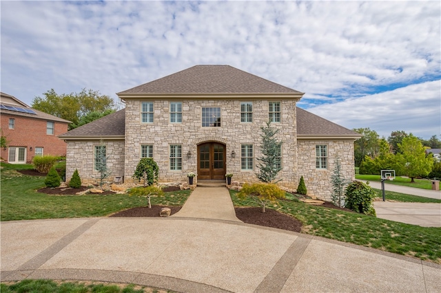 colonial inspired home with a front yard