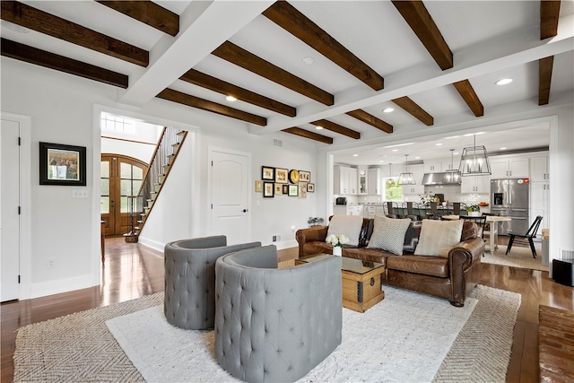 living room with wood-type flooring and beamed ceiling