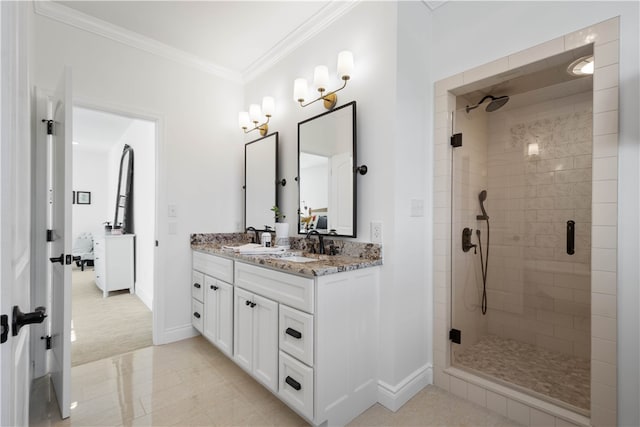 bathroom featuring tile patterned floors, a shower with door, vanity, and crown molding