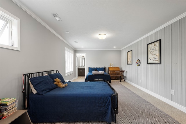 bedroom with wooden walls, multiple windows, light colored carpet, and crown molding