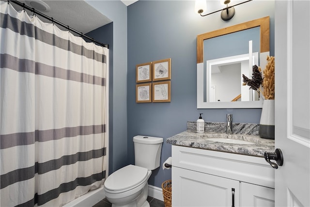 bathroom with vanity, toilet, a shower with shower curtain, and tile patterned floors