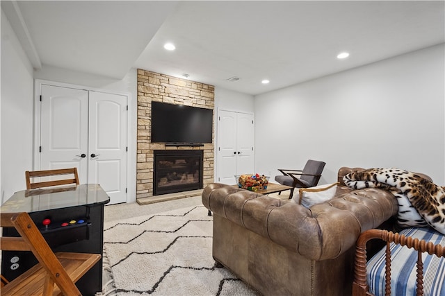 carpeted living room with a fireplace