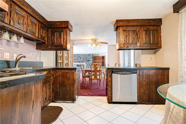 kitchen featuring light tile patterned flooring, sink, kitchen peninsula, ceiling fan, and stainless steel dishwasher