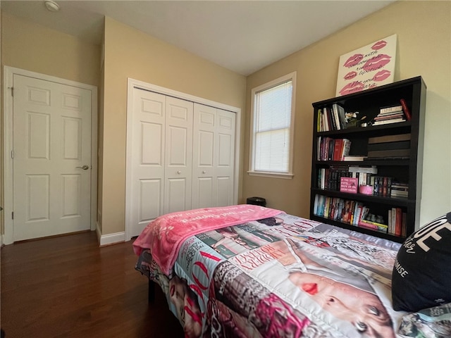 bedroom featuring a closet and dark hardwood / wood-style floors