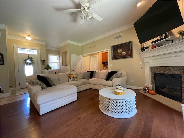 living room with ceiling fan, dark wood-type flooring, and crown molding