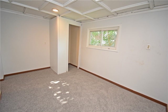 unfurnished room featuring light carpet