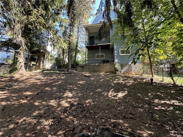 view of yard with a balcony