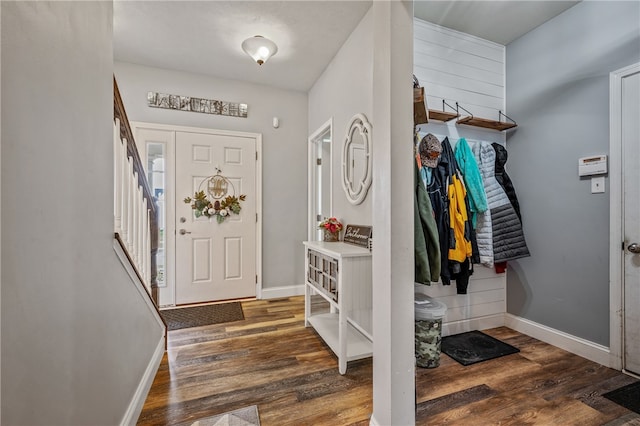 entryway with dark wood-type flooring