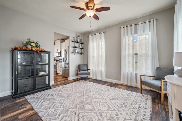 unfurnished room with ceiling fan and dark wood-type flooring