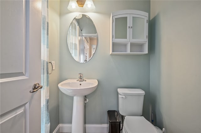 bathroom with toilet and sink