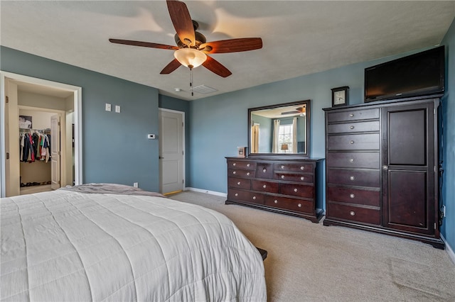 bedroom featuring ceiling fan and light carpet