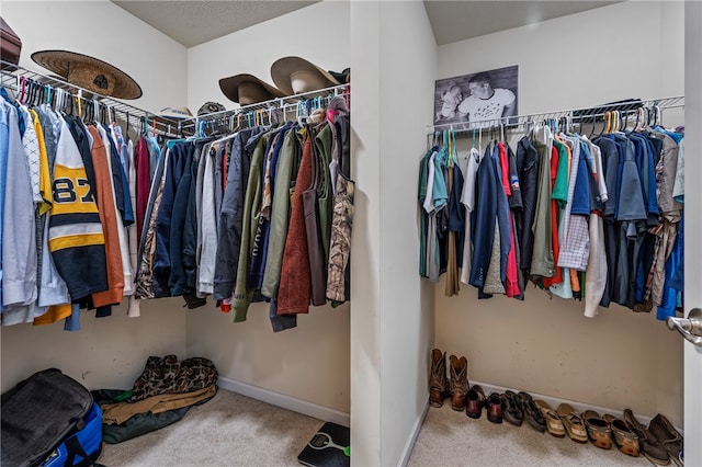 walk in closet featuring carpet floors