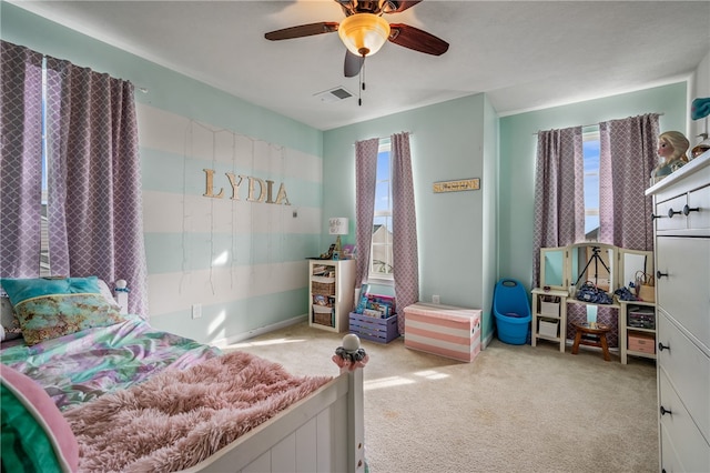 carpeted bedroom featuring ceiling fan