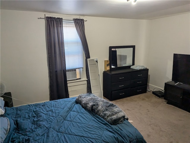 bedroom featuring light carpet and cooling unit