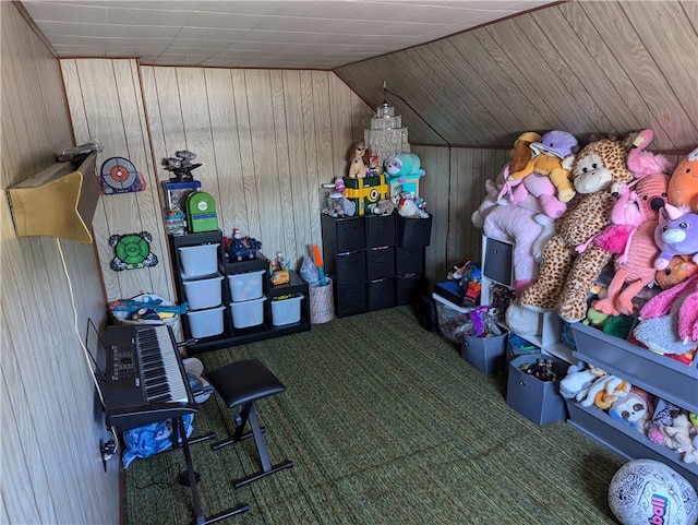 playroom featuring wood walls, carpet flooring, and vaulted ceiling