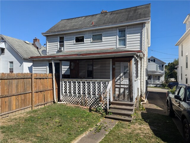 view of front of house featuring a front lawn and a porch