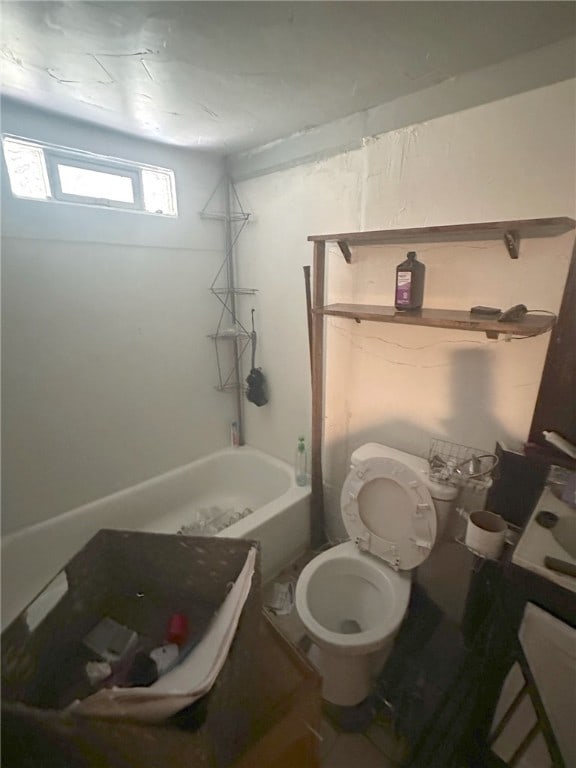 bathroom with toilet and  shower combination