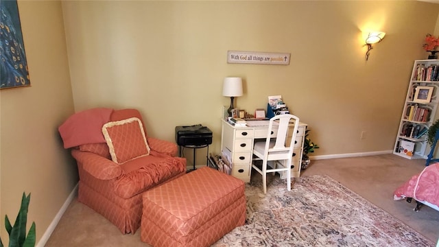 living area with carpet