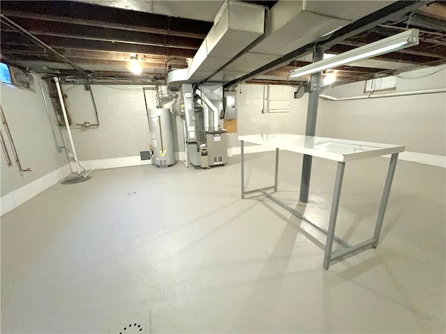 basement with water heater and heating unit