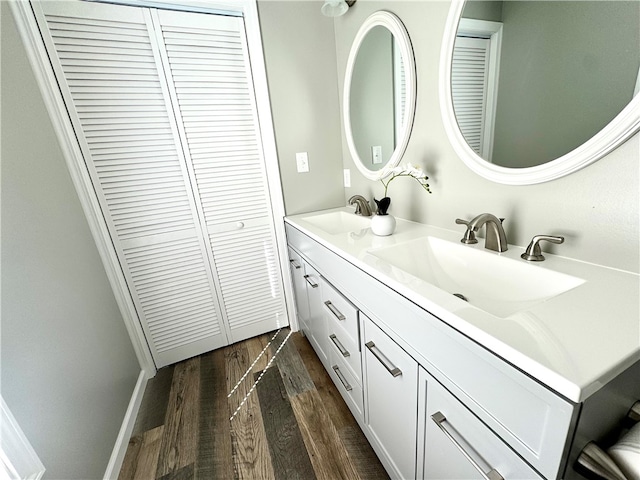 bathroom featuring vanity and wood-type flooring