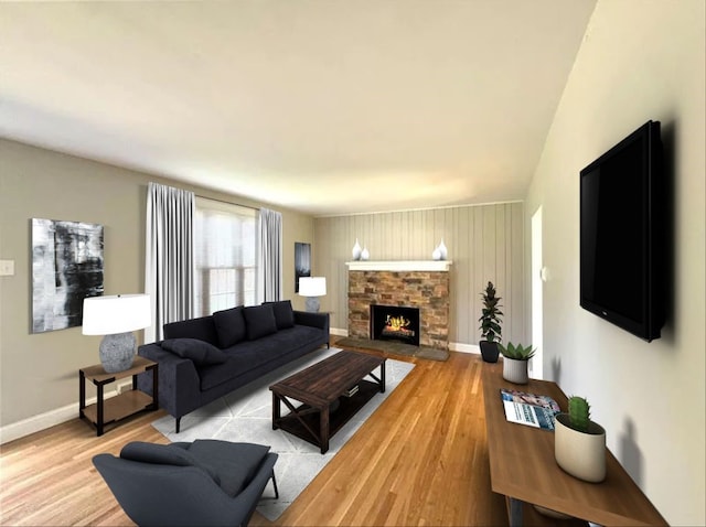 living room featuring light hardwood / wood-style flooring, wooden walls, and a fireplace