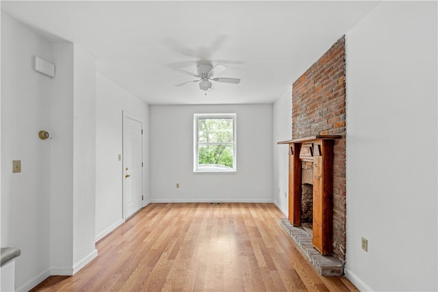 unfurnished living room featuring light hardwood / wood-style floors and ceiling fan