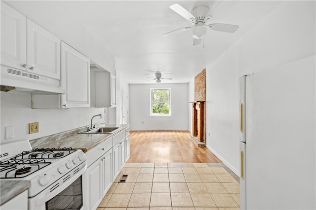 kitchen with light hardwood / wood-style flooring, white appliances, ceiling fan, and white cabinetry