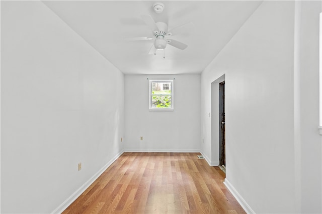 spare room featuring ceiling fan and light hardwood / wood-style flooring