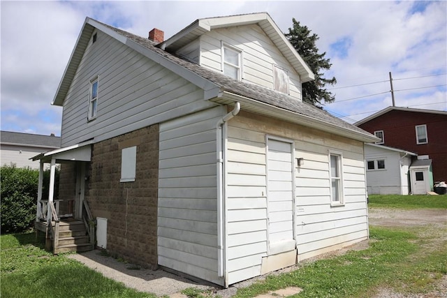 820-822 Grant St, Indiana Boro, PA 15701 - view of home's exterior with a shingled roof and a chimney
