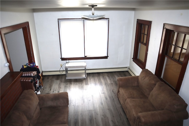 living room featuring a baseboard radiator and dark wood-type flooring