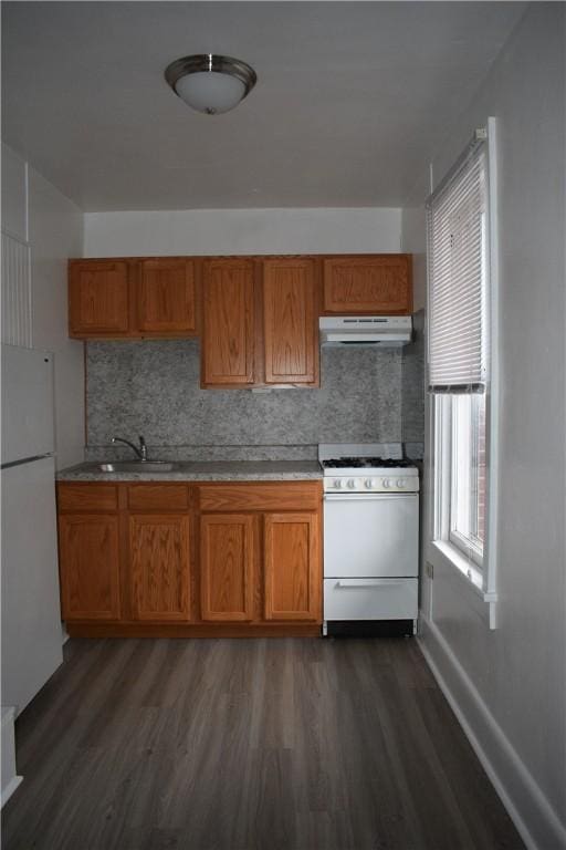 820-822 Grant St, Indiana Boro, PA 15701 - kitchen with white appliances, under cabinet range hood, dark wood finished floors, and brown cabinets