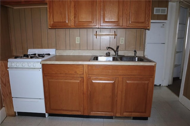 820-822 Grant St, Indiana Boro, PA 15701 - kitchen featuring white appliances, brown cabinetry, and light countertops