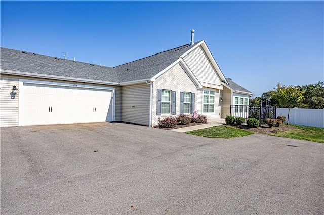 ranch-style home featuring a garage