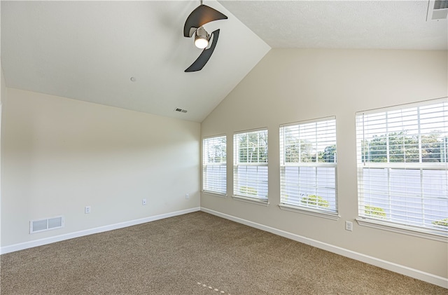 unfurnished room with carpet, vaulted ceiling, and ceiling fan