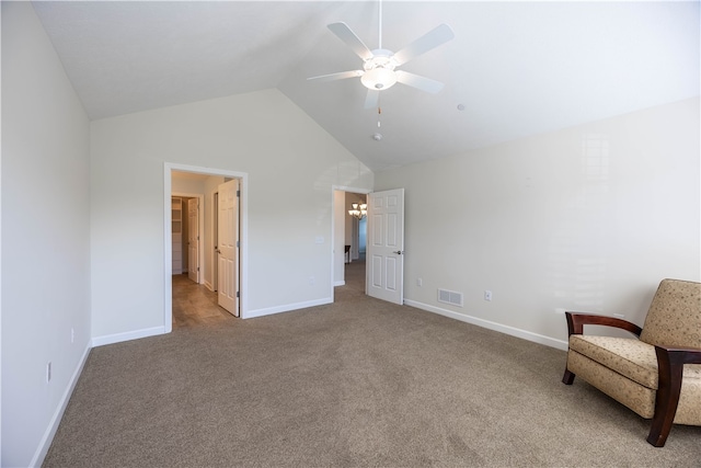 unfurnished room with ceiling fan, light colored carpet, and vaulted ceiling