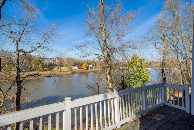 wooden terrace featuring a water view