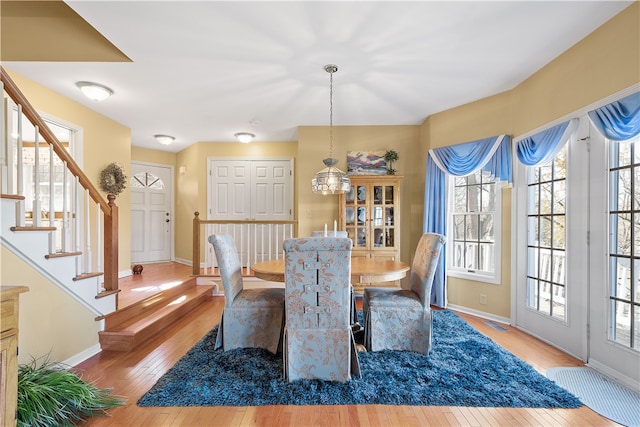 dining room featuring a notable chandelier and hardwood / wood-style floors