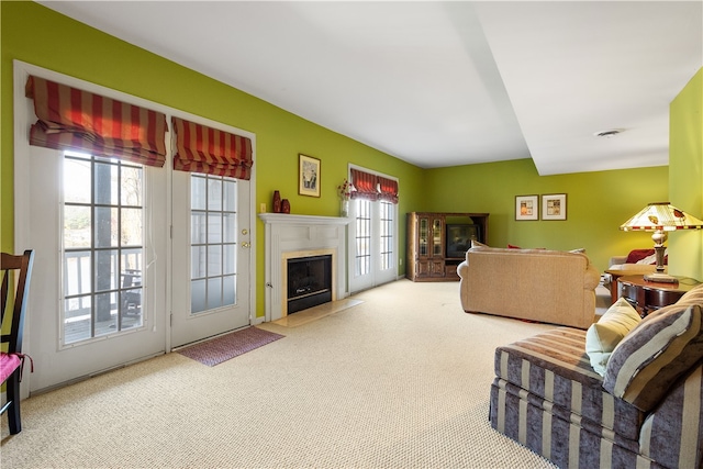 living room featuring a wealth of natural light and carpet floors