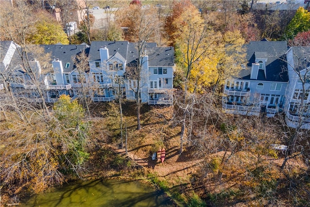 birds eye view of property featuring a water view