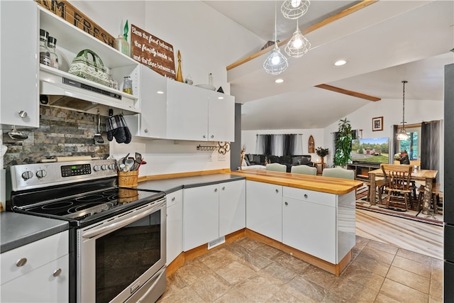 kitchen featuring white cabinets, vaulted ceiling, stainless steel range with electric cooktop, and decorative light fixtures