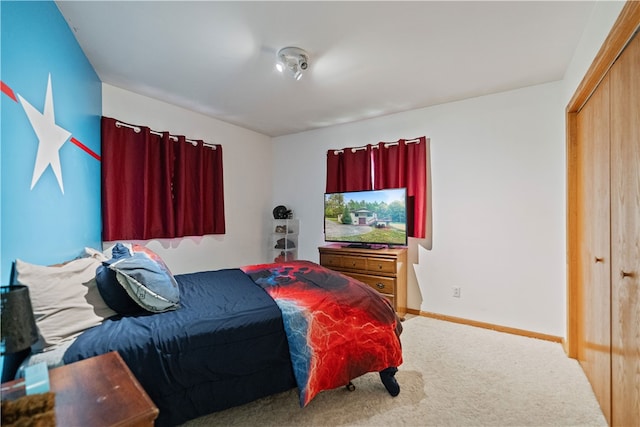 carpeted bedroom featuring a closet