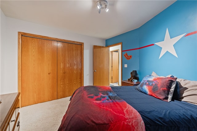 carpeted bedroom with a closet