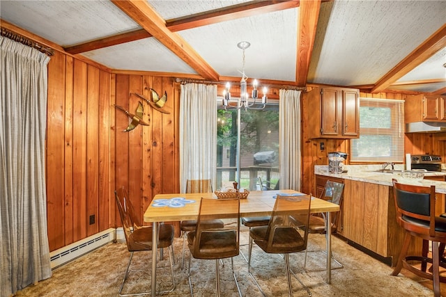 dining space featuring a notable chandelier, wood walls, beamed ceiling, and a baseboard radiator