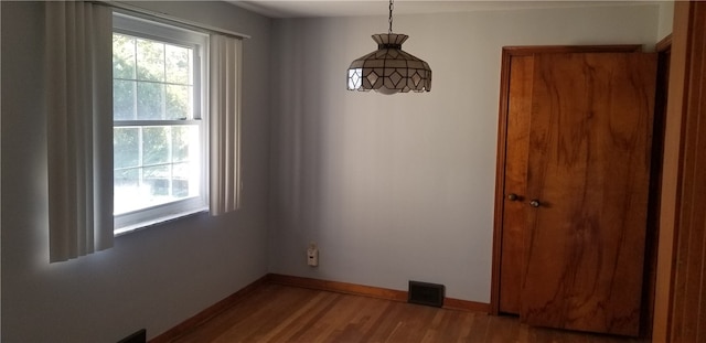 interior space with hardwood / wood-style flooring